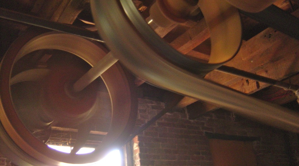 Overhead belt and pulley system to power all the tools