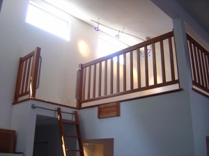 Railings, hand rails and ladder completed and installed. Matching cabinet is for storage of the ladder when not in use.