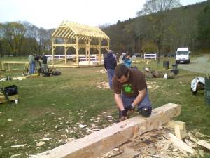 Bill hewing the log into a square timber