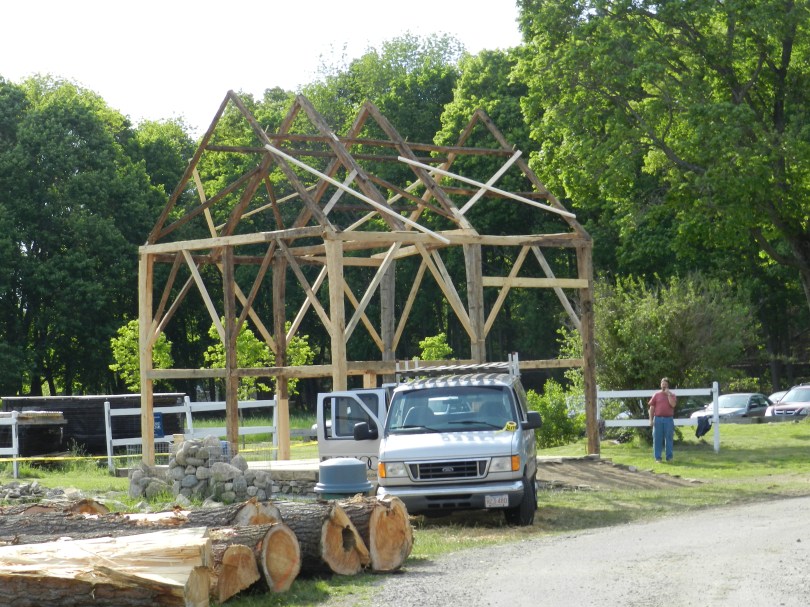 School van in front of the barn frame