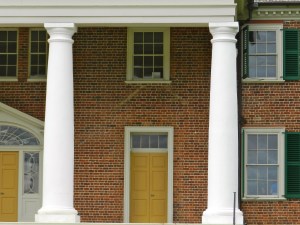 Earlier entrance to the older portion of the home, note the ghost lines in the brick