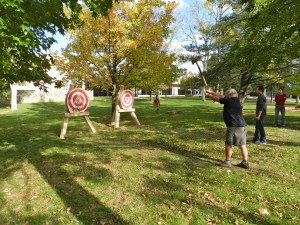 Kim Catlin (NBSS Graduate) Throwing an Axe