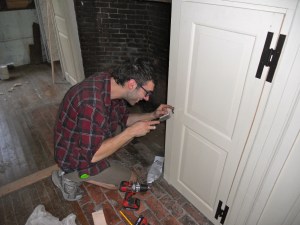 Martin Hickman fine tuning some hardware during installation