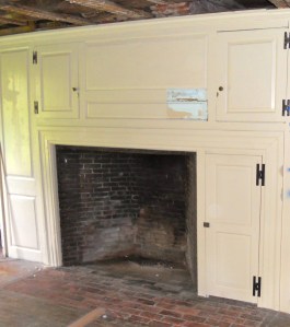 The 'After' -- the restored surround, paneling and cabinets have been re-installed and are looking great. The off color patch in he middle will be preserved under glass as a reminder of the change this woodworking has seen and for future paint analysis if ever needed again in the future.