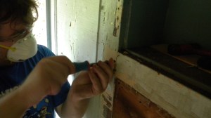 Carefully removing pins so we can disassemble the paneling