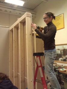 Students cutting and hanging sheetrock