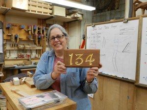 Janet Collins with completed sign