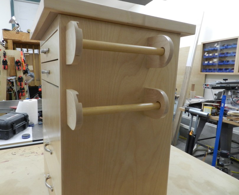 Dual paper towel holders -- one for regular paper towels, one for shop towels