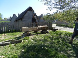 Justin Keegan (NBSS CFM + Plimoth Interpretter) hewing a log