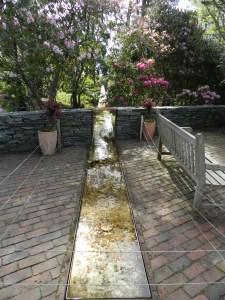 The Heritage Museum's trough that leads seemingly uphill to a waterfall. Very Neat.