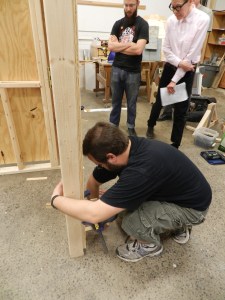 Using shims to center and plumb up the door