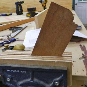 Cut out the semi-circle. Use a coping or jeweler's saw to hog out most and clean up with the Sloyd knife, or just use the knife to do all the work