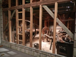 Peering into the Dominy Furniture Workshop from Long Island, NY you can see the great wheel lathe and workbenches