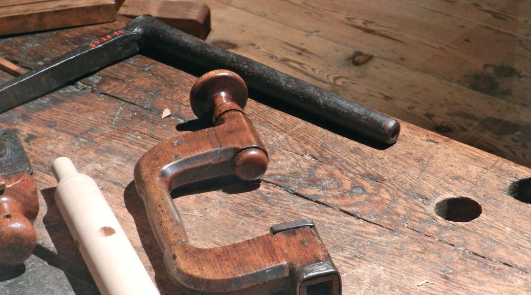 Massive hold-fasts that would have made Roubo proud. Note that for the hold-fast on the bench, the arm is at an unusual angle.