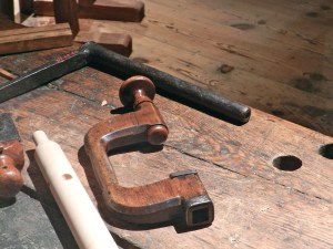 Massive hold-fasts that would have made Roubo proud. Note that for the hold-fast on the bench, the arm is at an unusual angle.