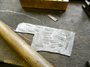 Testing the stamps on some lead flashing