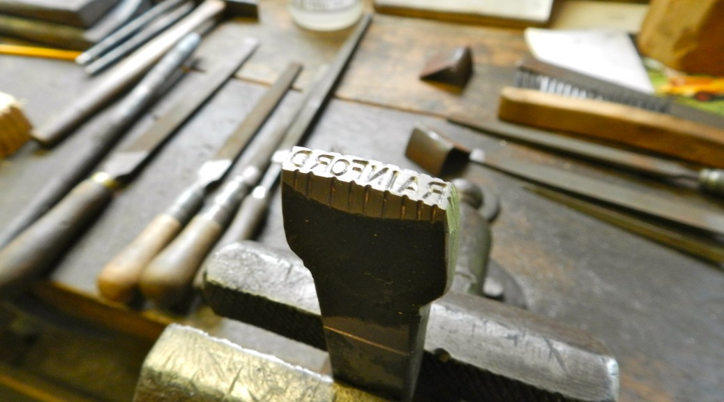 My second stamp -- 'RAINFORD' with a slight curve over the length of the stamp