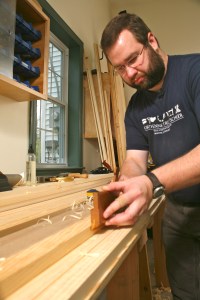 Bill Rainford using molding planes to reproduce traditional molding profiles. (Photo courtesy of the Taunton Press)