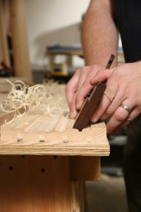 Using traditional molding planes to replicate the profile. (Photo courtesy of the Taunton Press)
