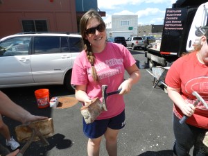 Rachel cleaning off some recovered bricks