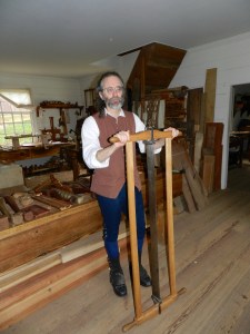 Ed Wright with a frame saw in Anthony Hay Cabinetmaker's Shop