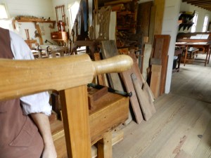 Close up detail of turned handles on the frame saw