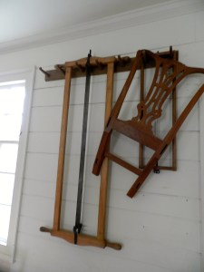 Frame saws hanging on the wall of the Hay Shop