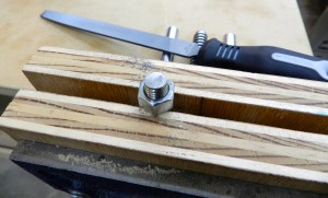 Filing off the rough machined edge