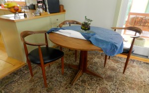 Round pedestal table and corner chairs