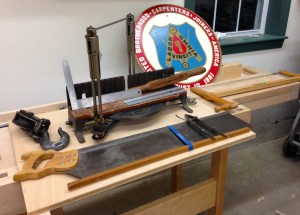 My finds this year -- Stanley 358 Miter Box _ Disston Saw, Carpenter and Joiner's Union Sign, Starret Rules and Dividers, Mini Framing Square, ECE Frame Saw, Heavy Duty Snatch Block, Auger Bit Handle