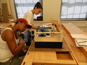 Dierdre and Julie painting their tool totes