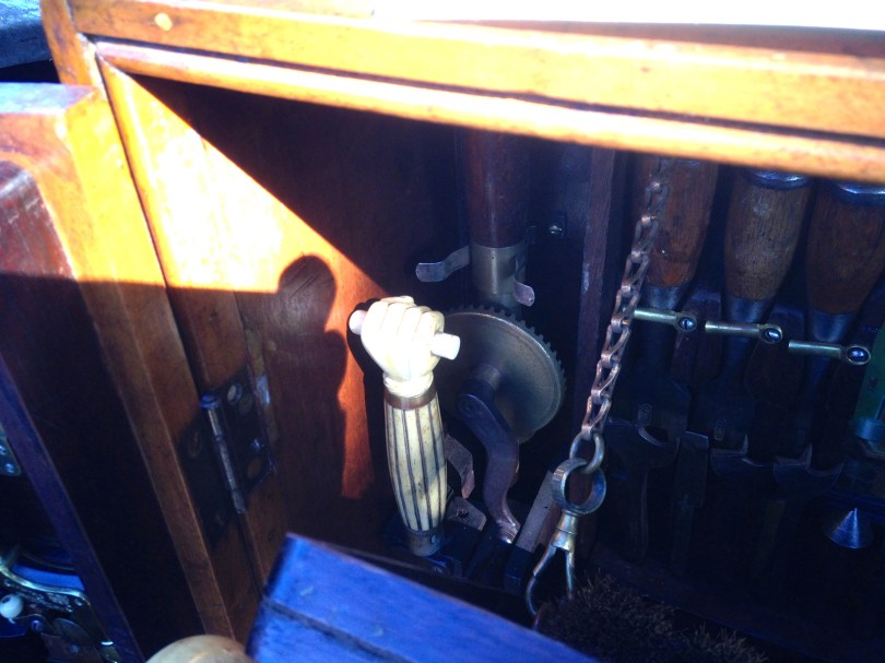 That fist is on the handle of an unusual saw