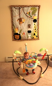 Bradley in front of his new wall hanging 