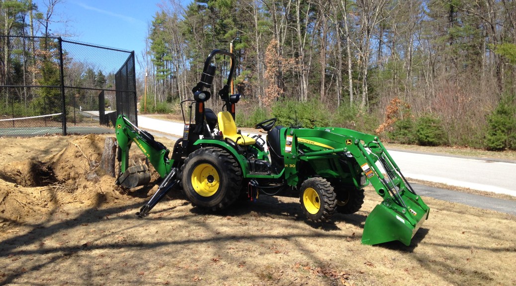 Tractor with back-hoe ready to go.