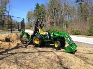 Tractor with back-hoe ready to go.