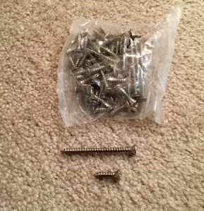 Brushed nickel screws. Better hinge sets will include some longer screws that are helpful in correcting/preventing door sag when used. 