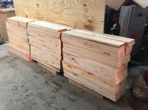 Stacks of cut legs and beams back in the shop