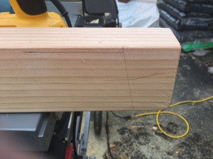 Laying out the beam. 5 degree angle is set in 2.5" from the end. The top of the legs should be 1/4" below the top of the beam. 