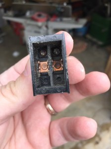 Carbon on the contact (sawdust from leaving the broken part sitting around the shop for a while)