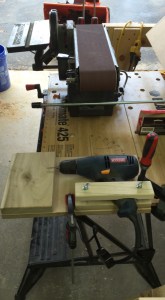 Drilling jig for pins (Foreground). Belt sander and disc sander for cleaning up and fitting box tops and bottoms