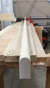 Stock getting ripped down to size and hand planed. Rounding over top of beam.