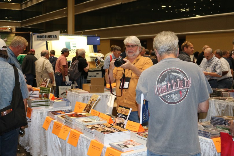 David Thiel of popular woodworking tweaking his camera. I always think photographs of other photographers are fun.