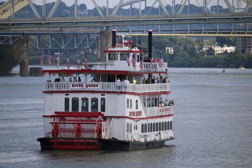 A paddlewheel sightseeing boat out on the river.