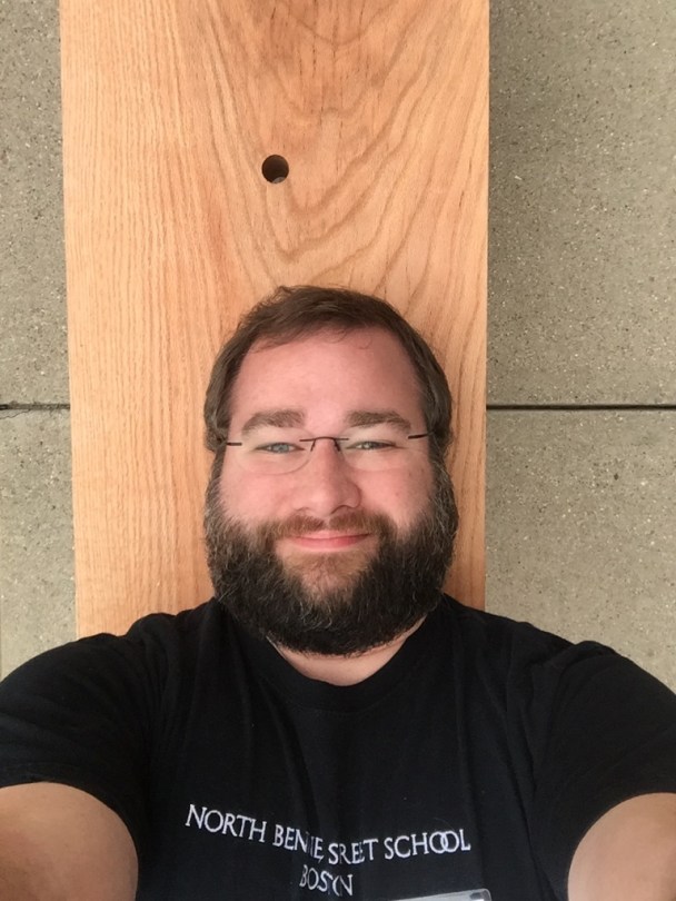 Selfie while laying on a Roman bench in the middle of a city sidewalk.