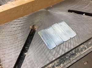 Zinc'ed steel bar, cut to size, corners ground round and edge burs removed