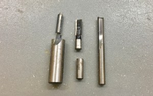Left to Right -- 1/4" straight bits -- MLCS 1/2" shank (broken), Craftsman 1/4" shank, Freud Diablo Solid Carbide