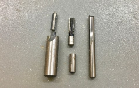 Left to Right -- 1/4" straight bits -- MLCS 1/2" shank (broken), Craftsman 1/4" shank, Freud Diablo Solid Carbide